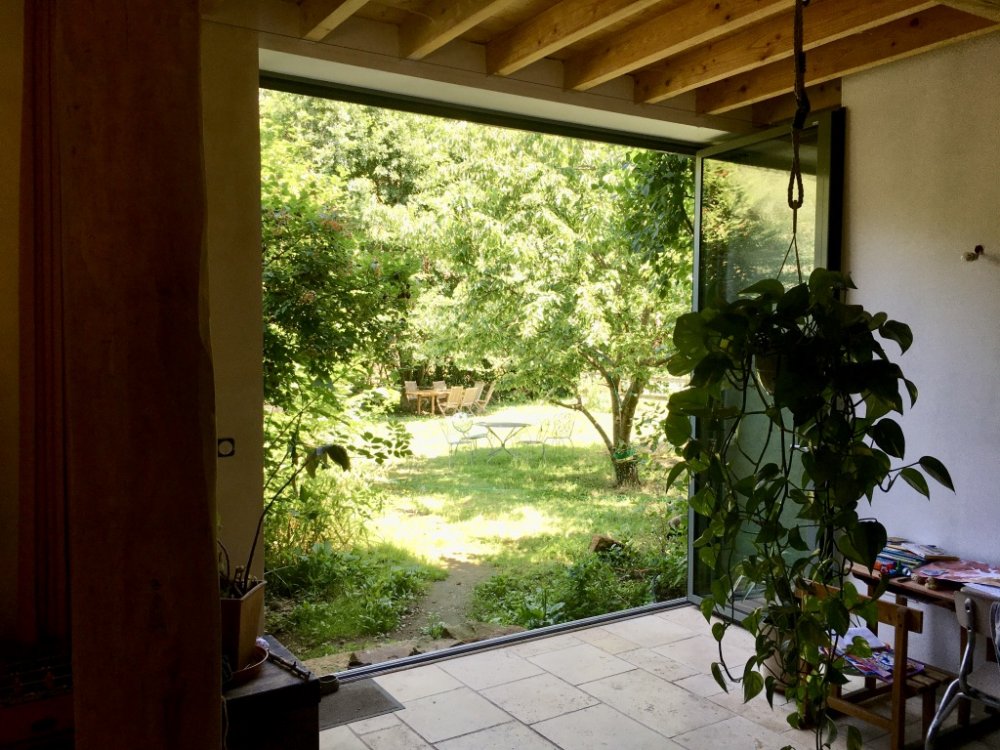 Rénovation d'une grange avec des baies accordéons