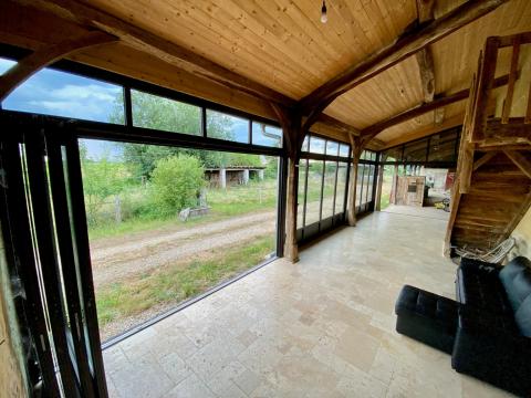 Extension d'une ancienne longère bressane avec nos systèmes aluminium en accordéon près de Bourg-en-Bresse dans l'Ain (01)
